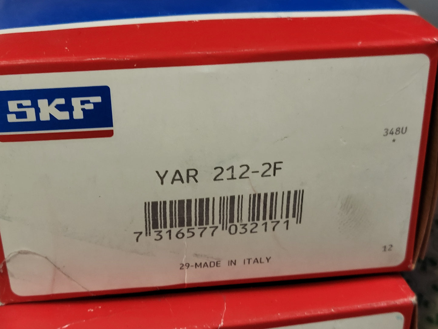 YAR212-2F, betétcsapágy állítócsavarokkal, rögzítőgyűrűvel és szélesebb belső gyűrűvel, SKF